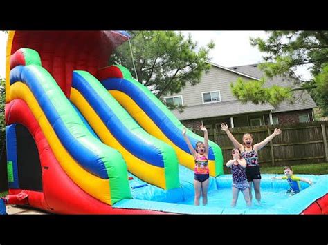 Kids On Inflatable Water Slide