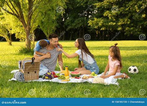 Happy Family Having Picnic in Park on Summer Day Stock Photo - Image of ...