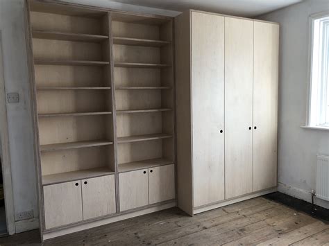 We built a bespoke birch plywood wardrobe with shelving and cabinets for a bedroom in Bath, UK ...