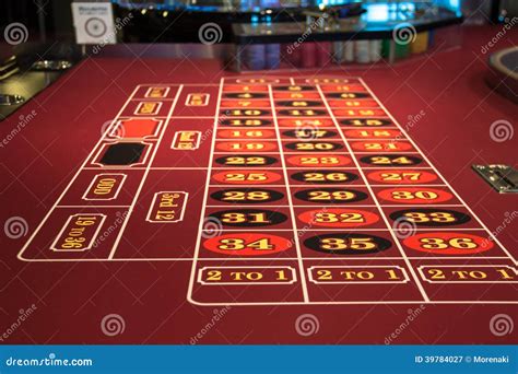 Roulette table in casino stock image. Image of gambling - 39784027