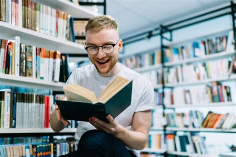 Happy Man Reading Book in Light Modern Library Stock Photo - Image of modern, indoors: 184742478