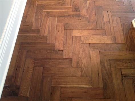 Walnut herringbone floor - I like this rotation of the pattern. This might fit our space better ...
