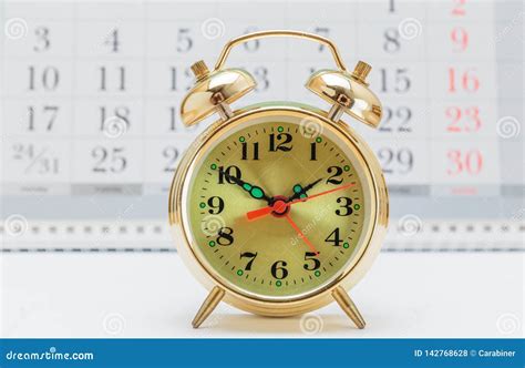 Alarm clock and calendar stock photo. Image of time - 142768628