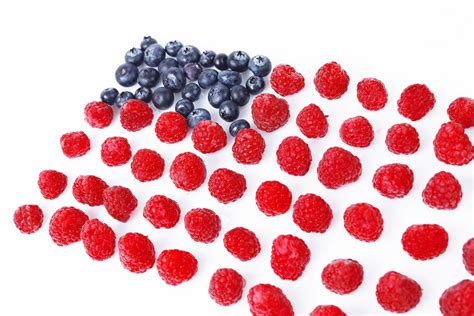 USA flag made of blueberries and raspberries, white background ...