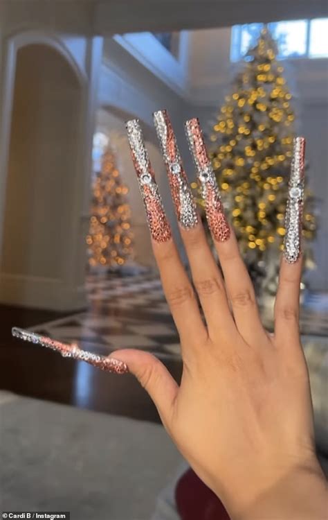 Cardi B shows of her dazzling new set of lengthy acrylic nails | Daily Mail Online