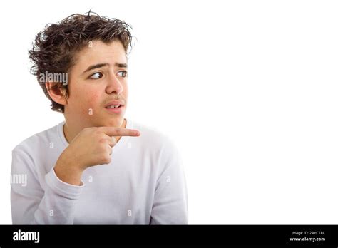 Hispanic boy worried points index finger to the right side Stock Photo - Alamy