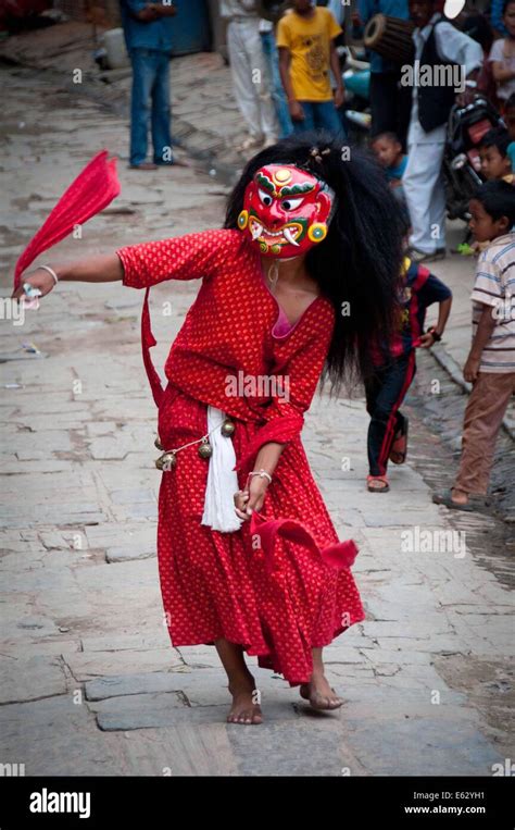 Lalitpur, Nepal. 12th Aug, 2014. A Newari in traditional costume performs Lakhey dance at ...