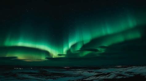 Premium AI Image | A green aurora borealis is lit up in the night sky.