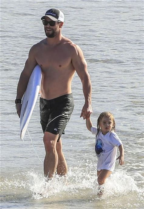 Hot dad Chris Hemsworth enjoyed an afternoon at the beach with one of his twin sons in Byro ...