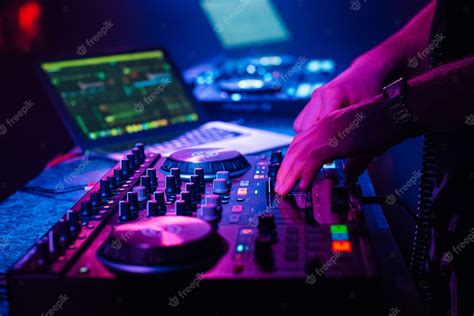 Premium Photo | Dj mixes electronic music with his hands on a music ...