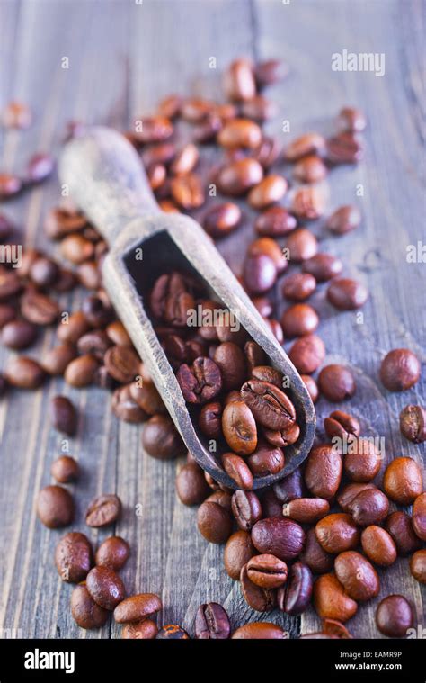 aroma coffee beans on the wooden table Stock Photo - Alamy