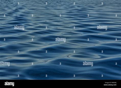 Waves on surface of water Stock Photo - Alamy