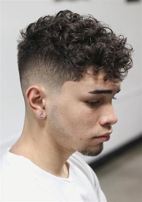 Curly Taper Fade - This messy, curled hairstyle is also finished with a fade on the sid… | Men ...