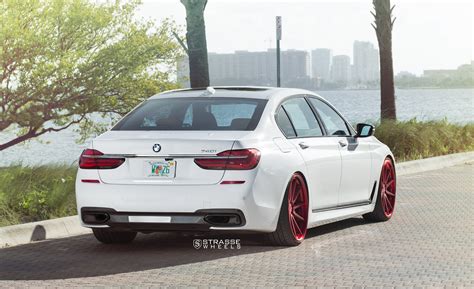 Stylish Transformation of White BMW 7-Series with Red Brushed Strasse Wheels — CARiD.com Gallery