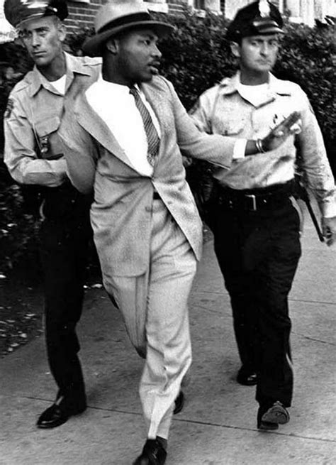 A photo of Martin Luther King Jr being arrested in 1964 for trying to get service at a whites ...