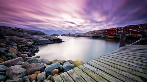 Colorful Houses Near River With Wooden Dock Under Purple Sky In Swedish West Coast 4K HD Nature ...