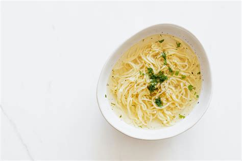 Bowl with chicken noodle soup and parsley · Free Stock Photo