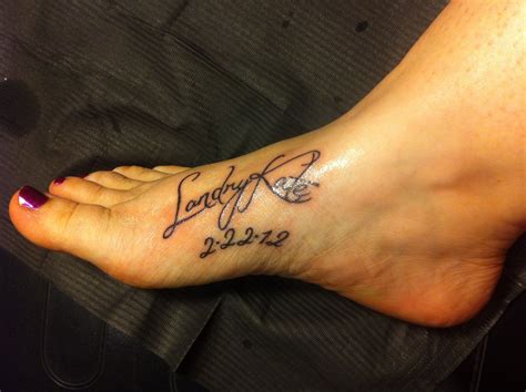 Daughters name and birthdate tattooed on my foot... I prob wouldn't put it on my foot, but I ...