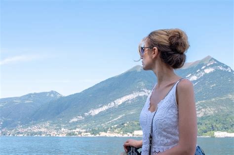 Premium Photo | Woman on the pier in como lake