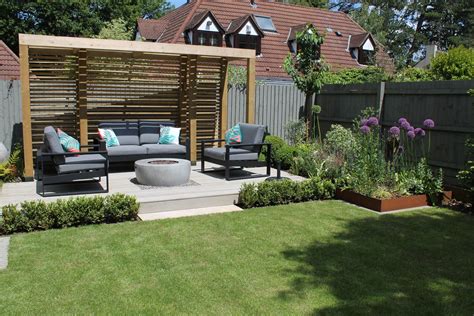 At the back of the garden a raised terrace was built using Millboard ...