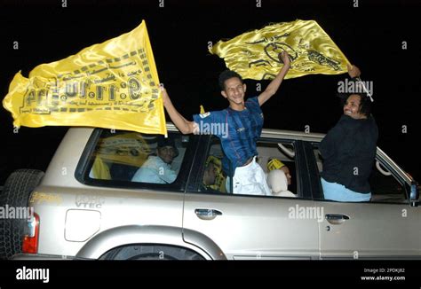 Saudi Al Ittihad fans wave flags as they celebrate after their team won ...