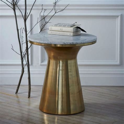 This brass side table with marble top is perfect for a modern interior ...