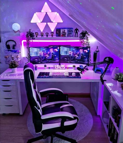 a room with a desk, chair and computer on it in the middle of an attic