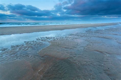 North Sea Coast at Low Tide in Dusk Stock Photo - Image of view, cloud: 49648362