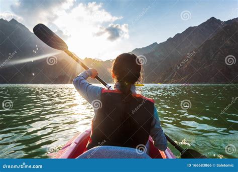 Woman Kayaking in a Lake at Sunset Stock Photo - Image of floating, active: 166683866