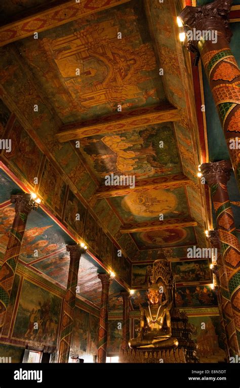 Wat Phnom. Inside ceiling with many painted murals telling stores, decorated columns Stock Photo ...