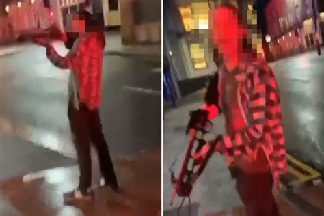 Shocking moment CROSSBOW-wielding thug points weapon at passer-by ...