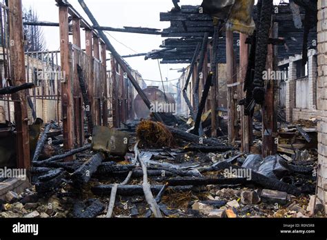 the ruins of a fully burned farm, disaster scene Stock Photo - Alamy