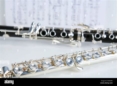 Clarinet and flute on sheet music Stock Photo - Alamy