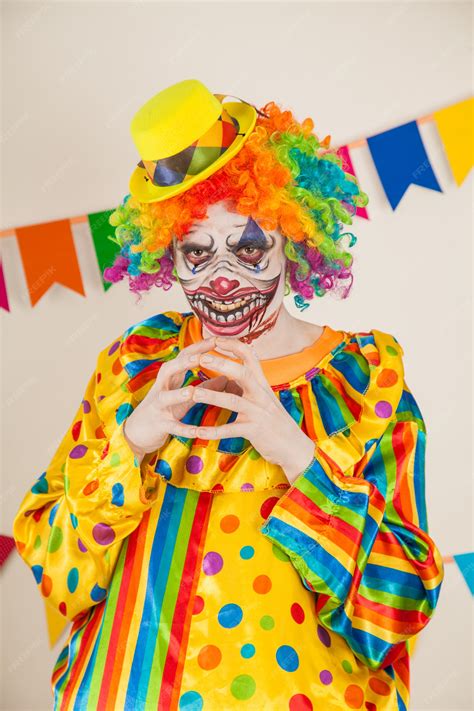 Premium Photo | Scary clown for halloween. violence and childhood fear