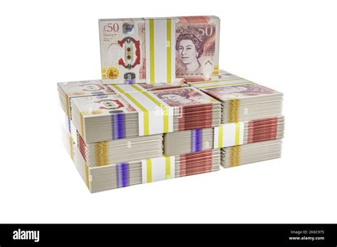 pile piles of UK money stack stacks of british polymer £50 notes bundle ...