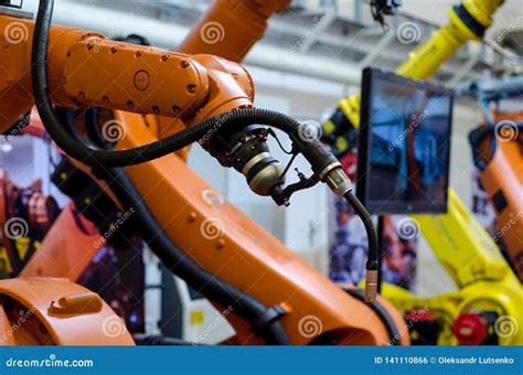 Different Industrial Robot Arms Stock Photo - Image of move, fair ...