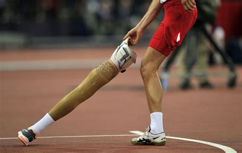 Poland’s Lukasz Mamczarz picks up his prosthetic leg