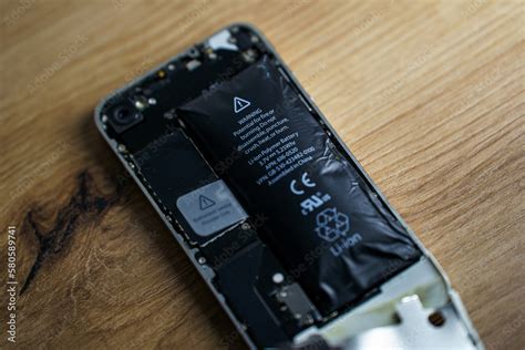 Iphone with exploded Lithium-ion battery. Li-ion swollen battery Stock Photo | Adobe Stock