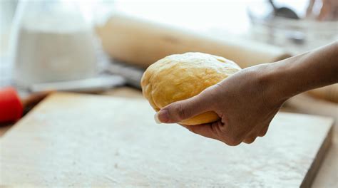 Happy woman with rolling pin cooking at home · Free Stock Photo