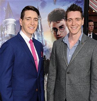 Actors Oliver Phelps and James Phelps attend the opening of 'The Wizarding World of Harry Potter ...