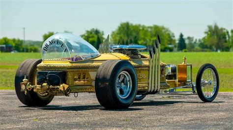 This coffin has been transformed into a four-wheeled V8 Dragula replica ...