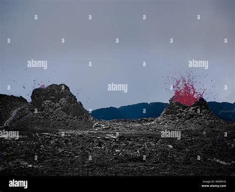 Volcano Erupting Red Lava Against Sky Stock Photo - Alamy