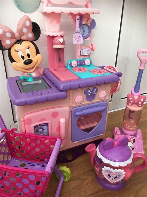 Minnie Mouse play kitchen, including Minnie tea set, Hoover and shopping trolley to sell ASAP ...