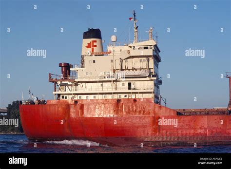 Lake freighter enters the St Clair River at the mouth of Lake Huron at Port Huron Michigan and ...
