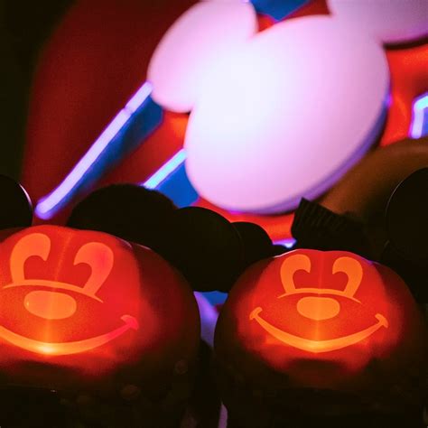 Two glowing smiling pumpkins with Mickey Mouse ears on a Disney Cruise Line ship