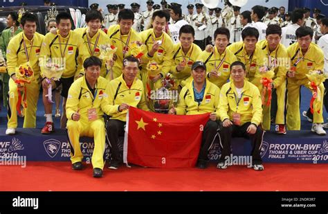 The Chinese team pose for a group photo on the podium after they ...