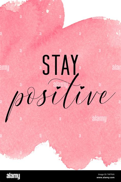 Stay positive. Inspiring quote with pink watercolor background Stock Photo - Alamy