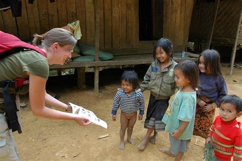 Handing Out a Book to Village Kids - Nong Khiaw, Laos | Flickr