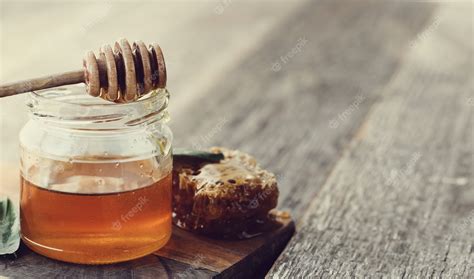 Free Photo | Honeycomb with jar