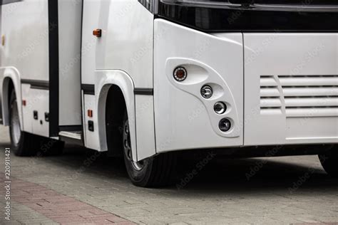 white shuttle bus with an open door Stock Photo | Adobe Stock